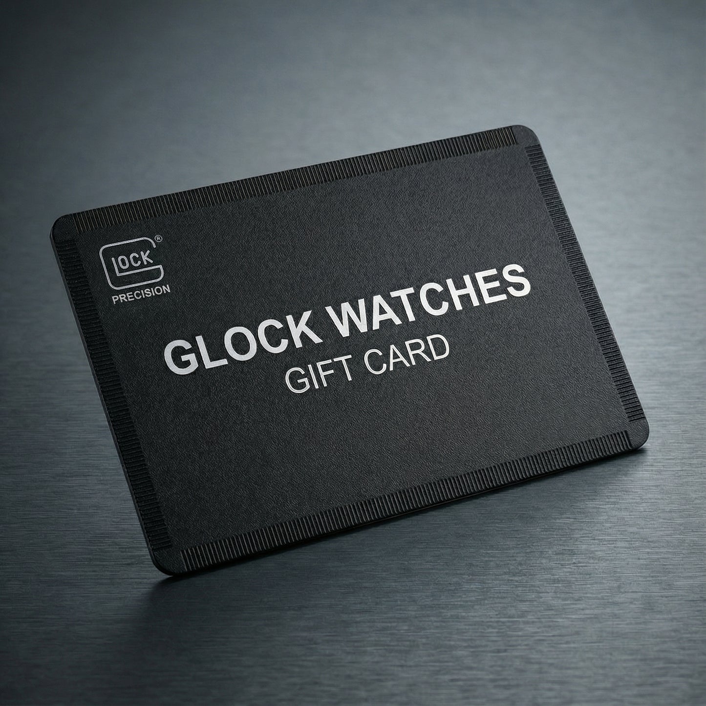 Black gift card for Glock watches on a dark gray background