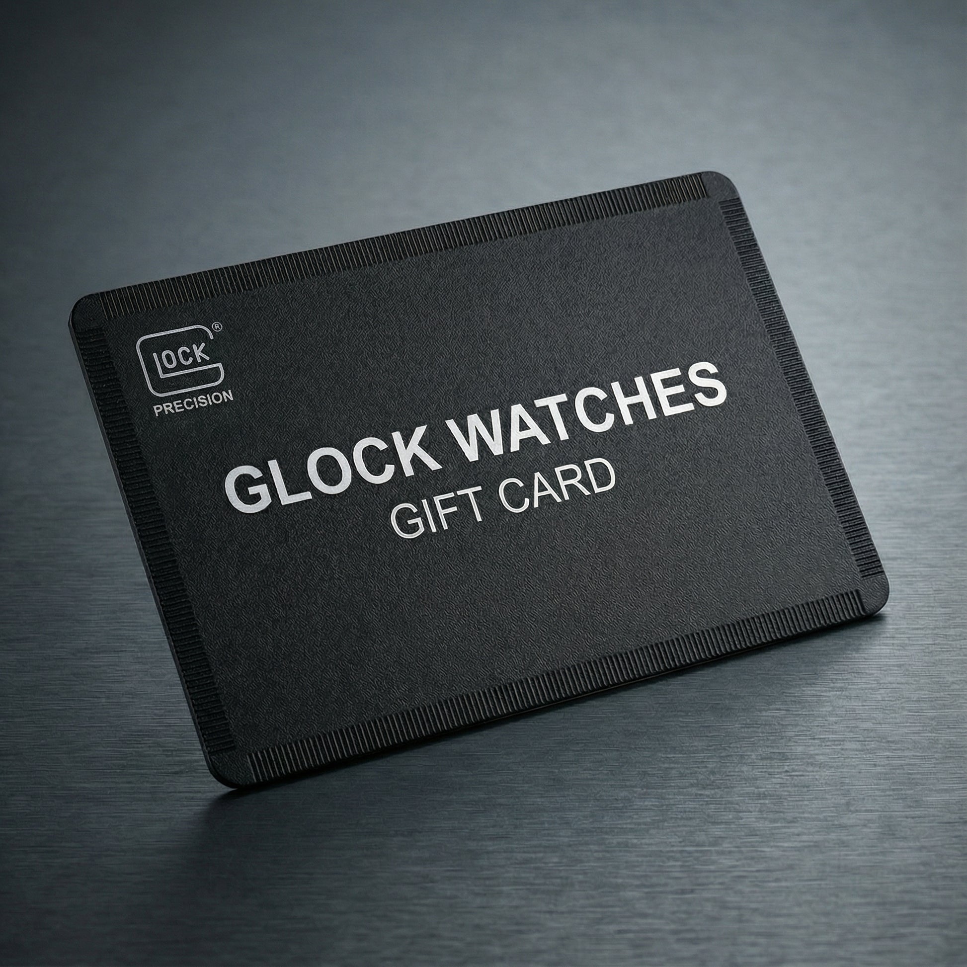 Black gift card for Glock watches on a dark gray background